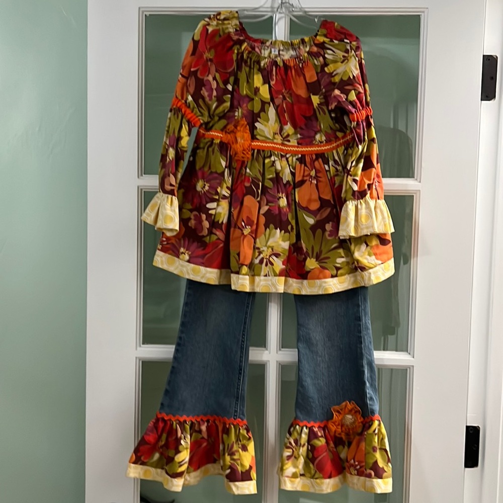 New handmade girls’ top and upcycled jeans, size 7.